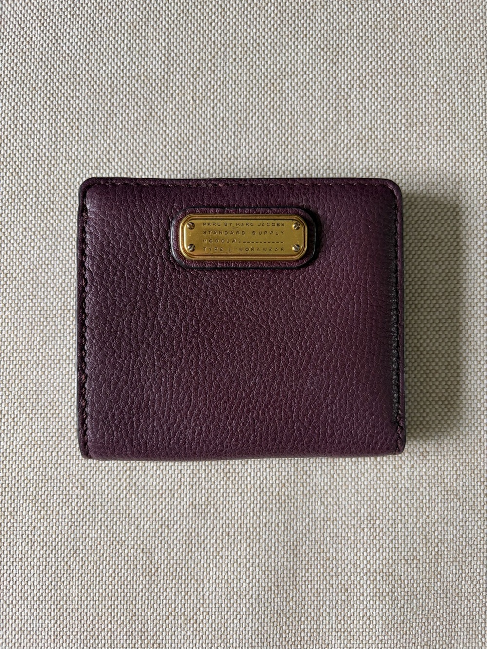 Marc by Marc Jacobs Deep Plum Pebbled Leather Bifold Wallet with Gold Plaque